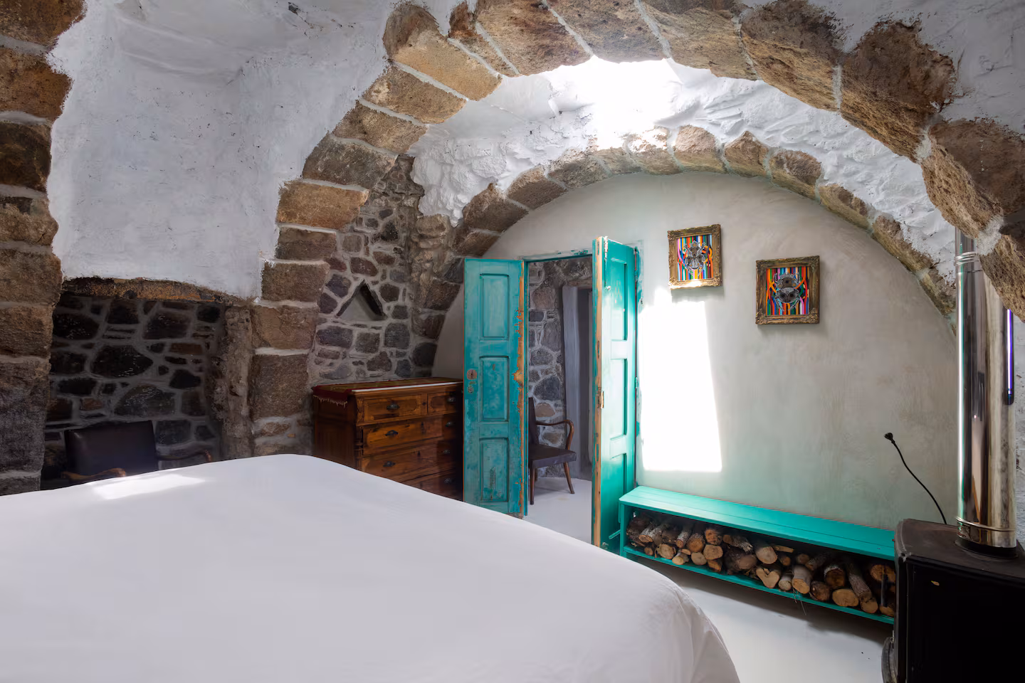 Main bedroom with stone walls
